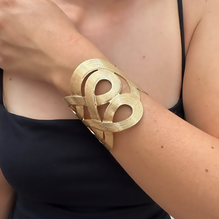 Bracciale traforato in bronzo dorato